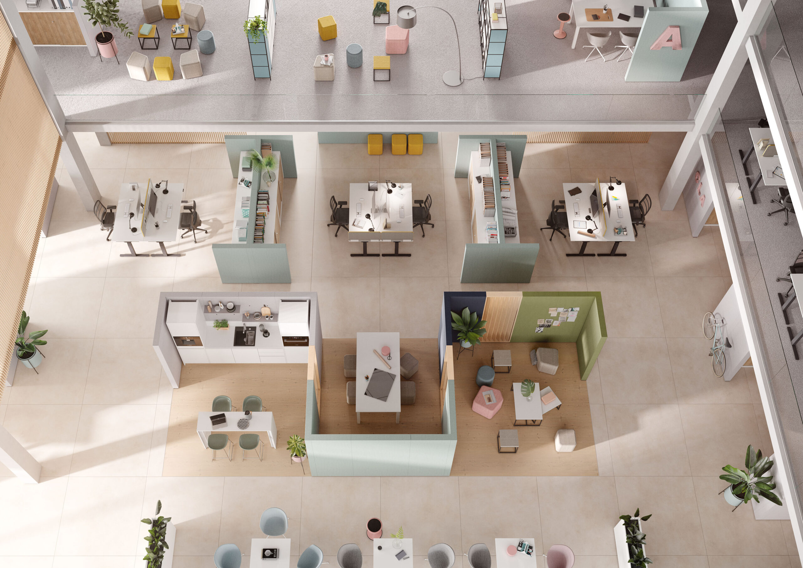 Offen gestaltetes Büro mit Schreibtischen, Regalen, Sitzbereichen, Meeting-Nischen und einer Küchenzeile, aus der Vogelperspektive fotografiert.